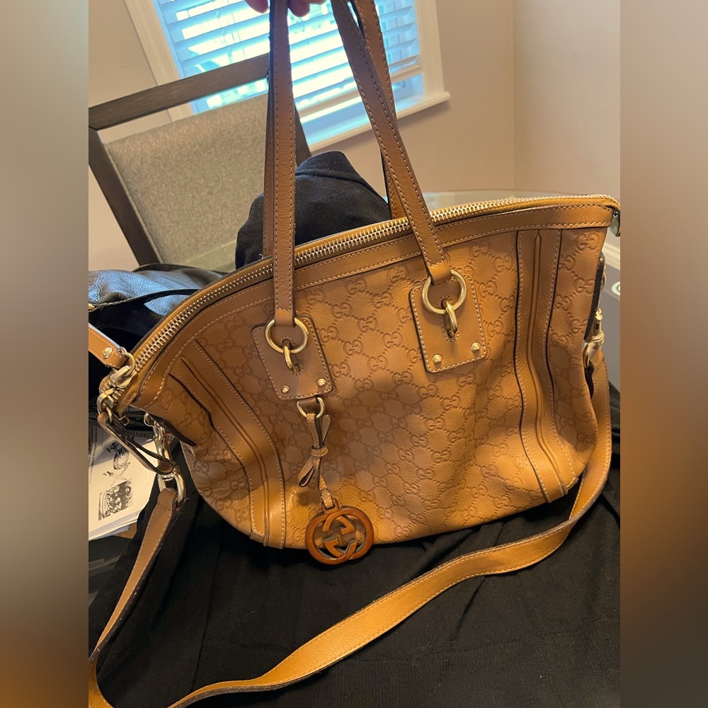 GUCCI
Beige Guccissima Leather Medium Charm Top Handle Bag